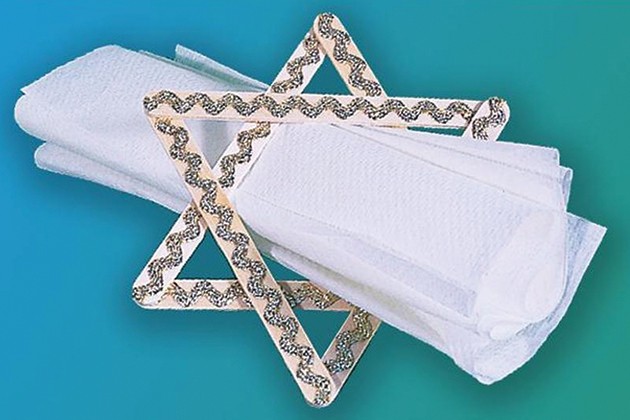 A napkin ring made of craft sticks in the shape of the Star of David.