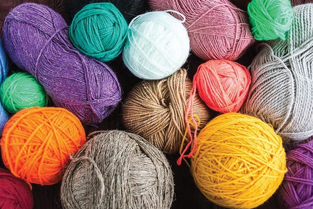 Yarn balls in different sizes and colors.
