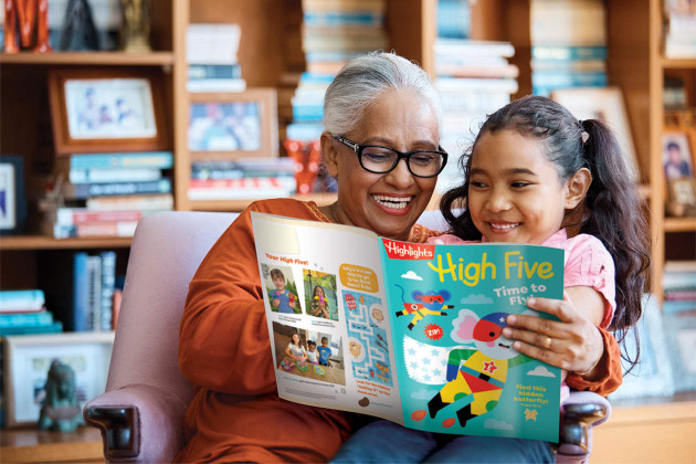Grandmother reading High Five magazine to her preschool grandchild. 