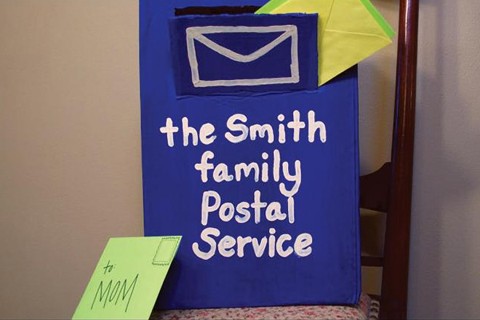 A cardboard mail box.