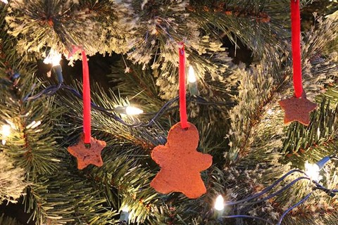 Cinnamon-scented ornaments hanging on a Christmas tree.